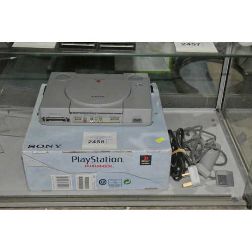 2458 - A boxed PlayStation 1 console with controller