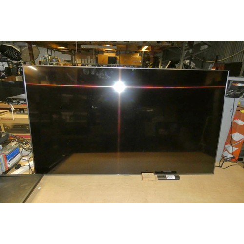 2570 - A 65 inch HDTV by Samsung type UE65TU7100K with remote control, No stand - trade   TESTED WORKING