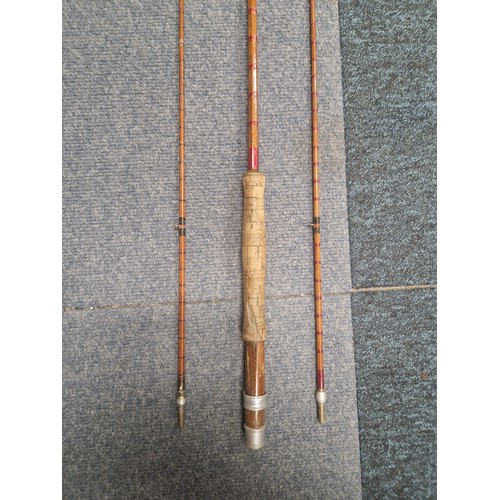 3094 - A vintage split cane fly fishing rod with a cork handle