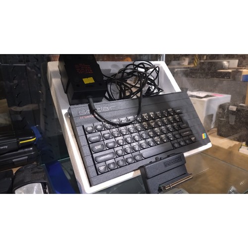 2427 - A vintage ZX spectrum+ computer by Sinclair with box, games, data player, ZX printer etc, contents o... 