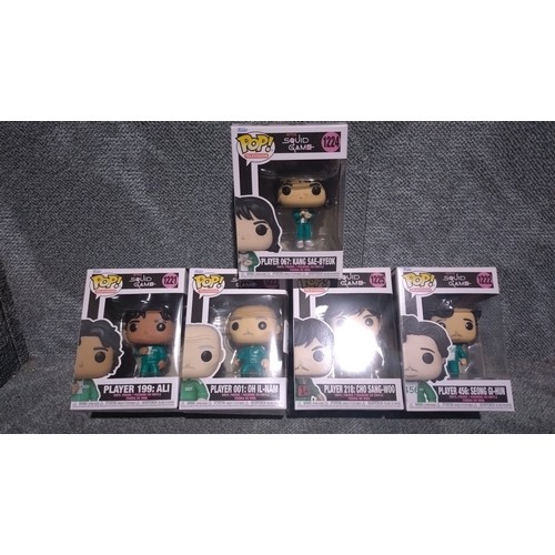 2663 - 10 various Funko collectibles including a premium Rusell Wilson figure, Squid Game Funko Pops, Rock ... 