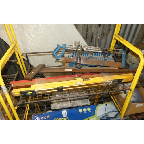 5004 - A quantity of various items including spirit levels and a hand operated mitre saw. Contents of 1 she... 