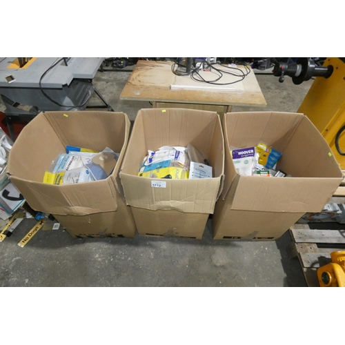 5712 - 3 cardboard boxes containing a large quantity of various vacuum cleaner bags, belts etc