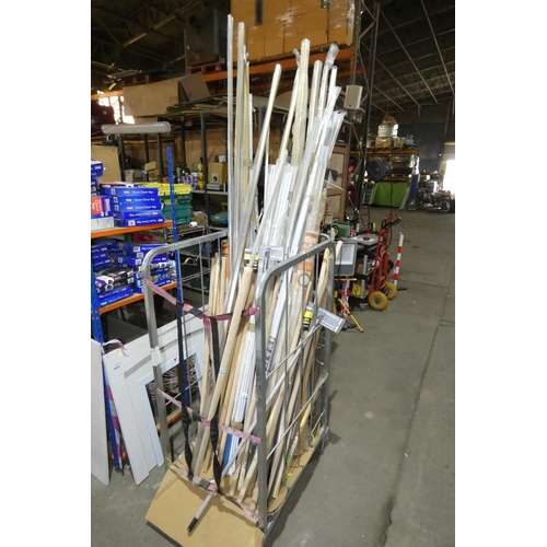 5821 - A quantity of various wooden broom handles, dry wall pole sanders, pile weather set door surrounds, ... 