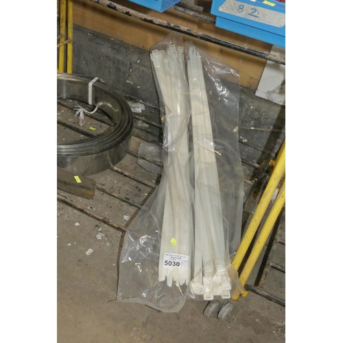 5030 - A quantity of large cable ties each approx 90cm long