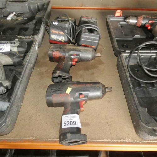 5209 - 2 x Snap On cordless impact wrenches supplied with 2 x chargers but no batteries