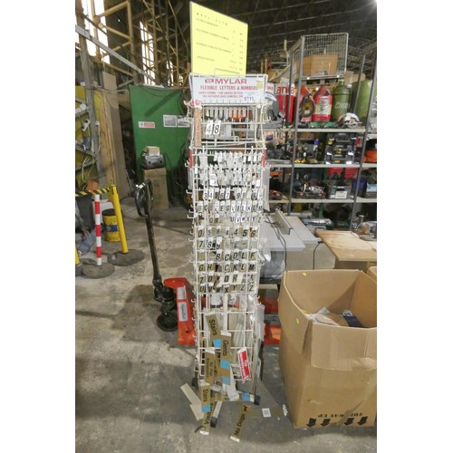 5711 - 1 x rotary display rack containing a quantity of various Mylar letters, numbers and signs