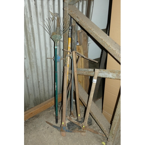 5909 - A quantity of various tools including a large rubber mallet, 2 x pick axes, 2 x stand pipes etc