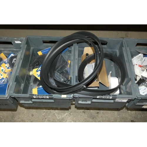 5673 - A quantity of various items including turn buttons, straps, nuts, bolts, rubber seal etc. Contents o... 