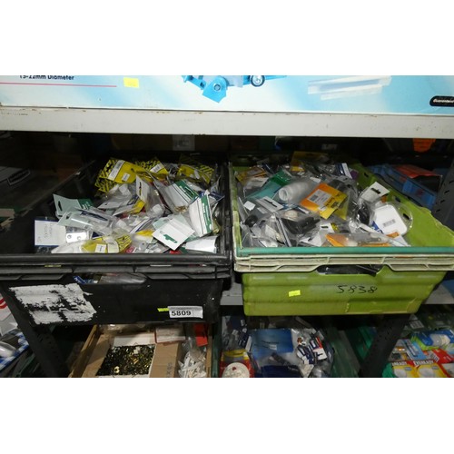 5809 - A quantity of various items including socket boxes, socket fronts, hooks, small hardware items etc. ... 