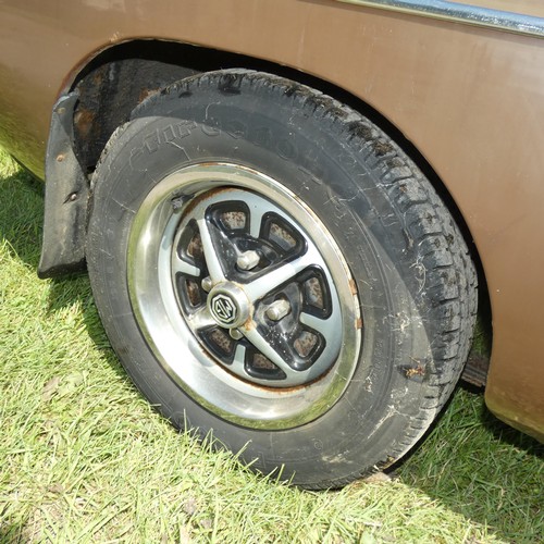 15 - MGB Sports Roadster, brown with dark Mohair soft top, Reg UUH 265S, 1st registered 20/03/1978, 4 spe... 