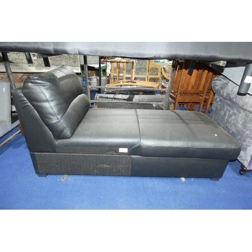 311 - A black upholstered Ottoman type hinged top storage  chaise longue. Please note that no arms are inc... 