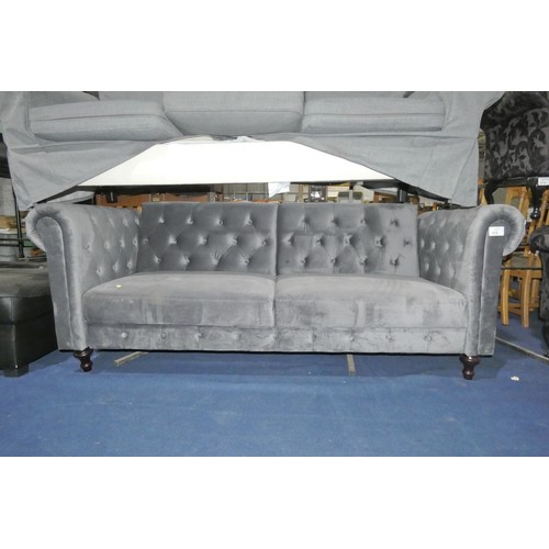 313 - 1 x grey upholstered three person click / clack type sofa bed approx 220cm wide. Please note this so... 