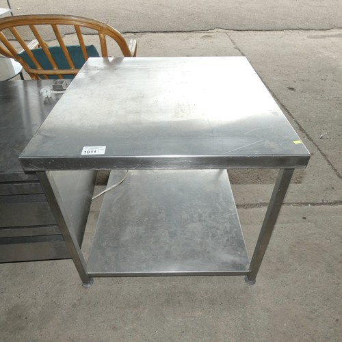 1011 - A commercial stainless steel catering type table with shelf beneath approx 80x85cm