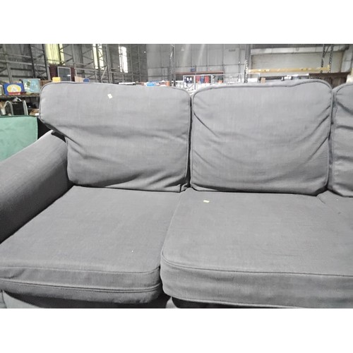 312 - 1 x grey upholstered three person sofa approx 215cm wide. Please note that this sofa is used and the... 