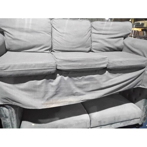 312 - 1 x grey upholstered three person sofa approx 215cm wide. Please note that this sofa is used and the... 