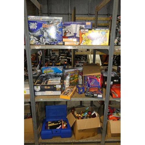 2108 - A quantity of various items including DVDs, games, toys, KNex etc. Contents of 1 bay / 3 shelves