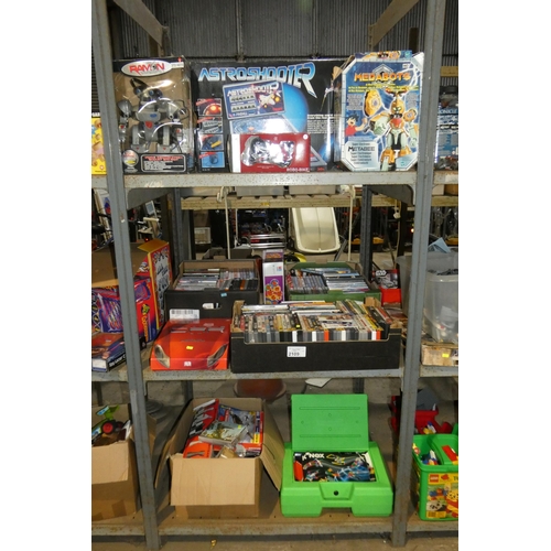 2109 - A quantity of various items including DVDs, games, KNex etc. Contents of 1 bay / 3 shelves