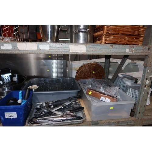 1049 - A quantity of various catering related items including wicker trays, stainless steel bowls, jugs, ti... 