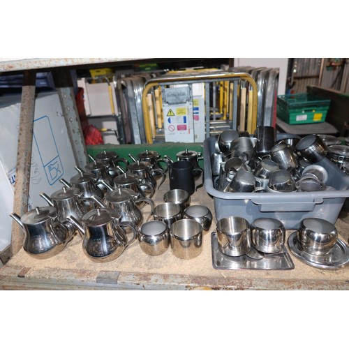 1052 - A large quantity of various stainless steel catering type items, teapots, milk jugs, sugar bowls etc... 