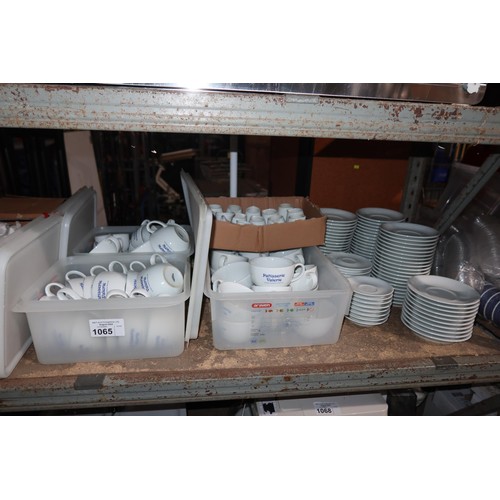 1065 - A quantity of various white crockery, cups and saucers, cups branded Patisserie Valerie