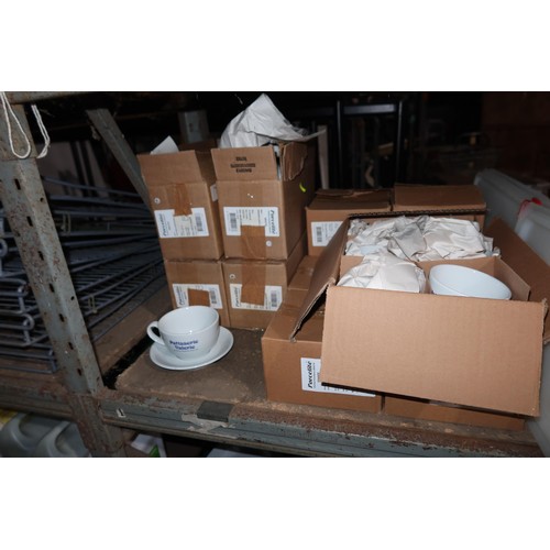 1065 - A quantity of various white crockery, cups and saucers, cups branded Patisserie Valerie