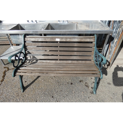 2662 - A 3 person garden bench with decorative metal ends