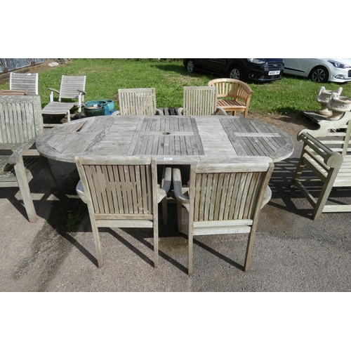 2664 - A large wooden garden table and 4 matching chairs