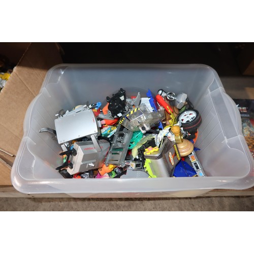 2102 - A quantity of various Transformer related items including toys, DVDs and a 3D 100 piece stand up puz... 