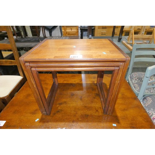 2163 - A vintage nest of 3 dark wood tables (no make visible)