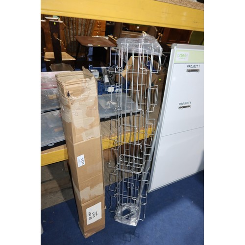 1435 - A part shop rotary display stand & a quantity of plastic racking/shelf slide on pricing protectors