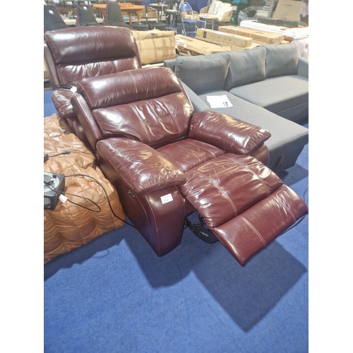 299 - 2 x deep burgundy leather upholstered electric reclining armchairs. Please note that the mains plugs... 