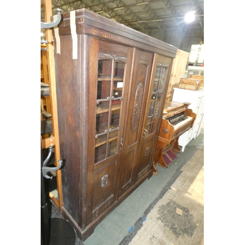 3216 - A dark wood storage / display cabinet with two part glazed doors and shelves inside approx 133cm w x... 