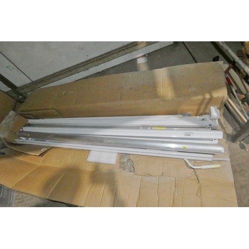 3168 - 1 box containing parts of a PM0583 bolt to wall wind out awning - Incomplete - No fabric awning incl... 