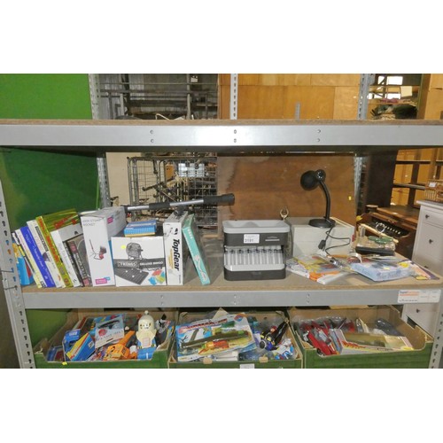 3191 - A quantity of various household items including a coin sorter, a table lamp 240v, books, DVDs etc. C... 