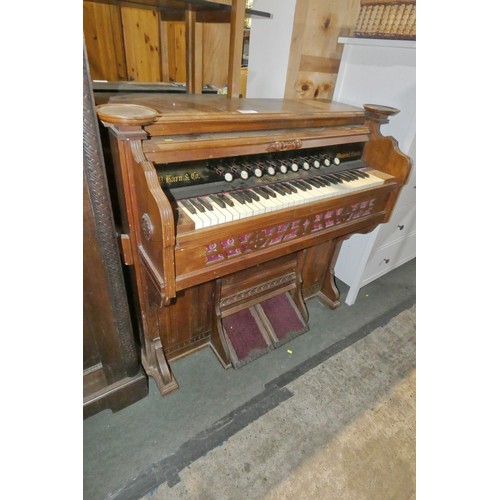 3217 - An Edwardian mahogany cased harmonium with ten stops and keyboard, foot bellows below, by DW Karn an... 