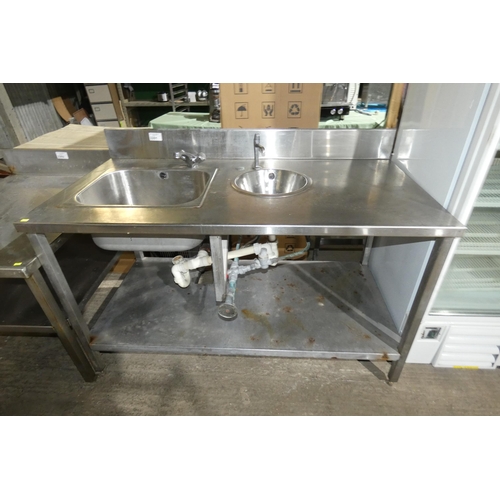 2201 - A commercial stainless steel double sink unit with shelf beneath and leg operated tap, approx 150x77... 