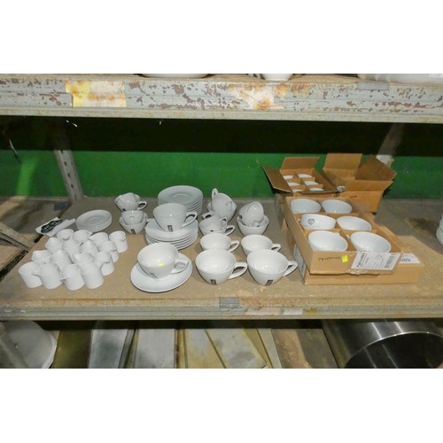 2089 - A quantity of various white crockery including milk jugs, cups and saucers