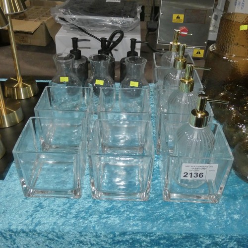 2136 - A quantity of various table decorations/center pieces and hand cream dispensers