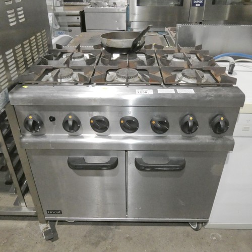 2238 - A commercial stainless steel gas fired 6 ring range with 2 door oven beneath - trade