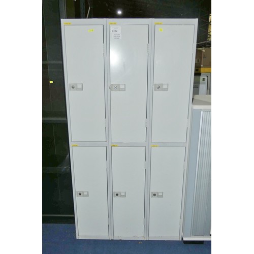 2392 - A grey metal 6 door personnel locker approx 92cm w x 178cm high - supplied with some keys