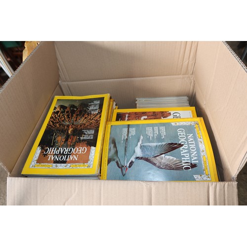 3188 - A large quantity of National Geographic magazines and maps. Contents of 1 wheeled cage which is not ... 