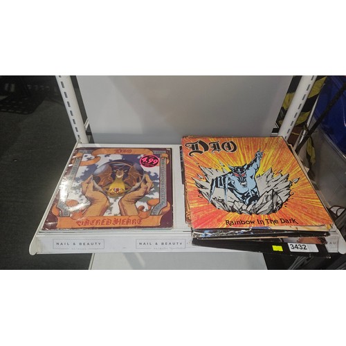 3432 - A quantity of various heavy metal 45rpm & 33rpm records including ACDC, Iron Maiden, Wasp, Guns and ... 