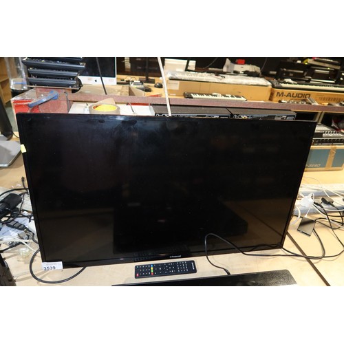 3539 - A 40 inch HDTV by Polaroid, no model visible, no stand, comes with a remote control - trade