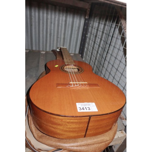 3413 - An acoustic guitar by Eugino Delicado Utrilla with soft carry case