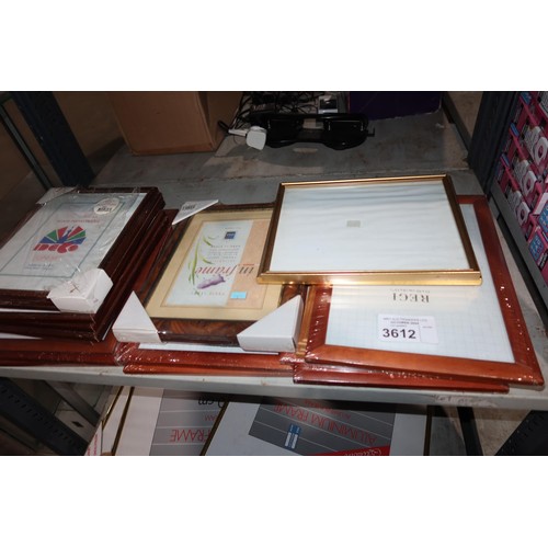 3612 - A quantity of various size picture frames, contents of 2 shelves