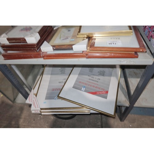 3612 - A quantity of various size picture frames, contents of 2 shelves