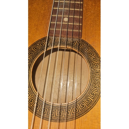 3411 - A small acoustic guitar with soft carry case, no make or model visible