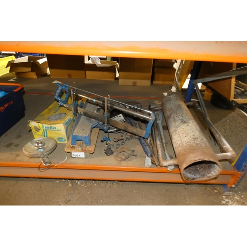 5207 - A quantity of various items including a hand mitre saw, a post rammer, wrenches etc