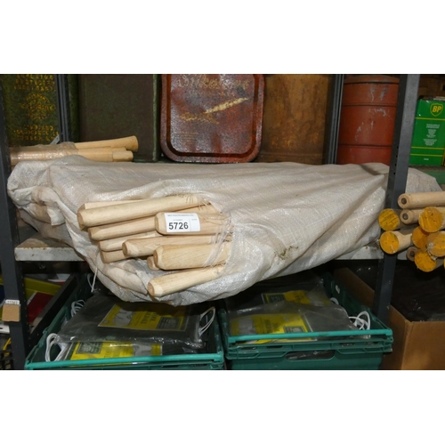 5726 - A quantity of various wooden handles for axes, pick axes etc. Contents of 1 shelf